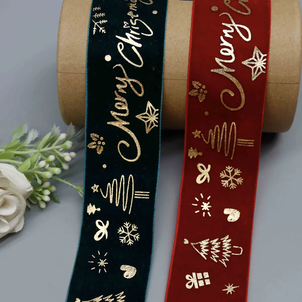 Red and dark green Christmas velvet ribbons with gold lettering, trees and snowflakes Red and dark green Christmas velvet ribbons with gold lettering, trees and snowflakes