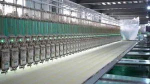 Detailed shot of embroidery machines inside a commercial lace factory producing intricate lace patterns for fashion and textiles. Detailed shot of embroidery machines inside a commercial lace factory producing intricate lace patterns for fashion and textiles.