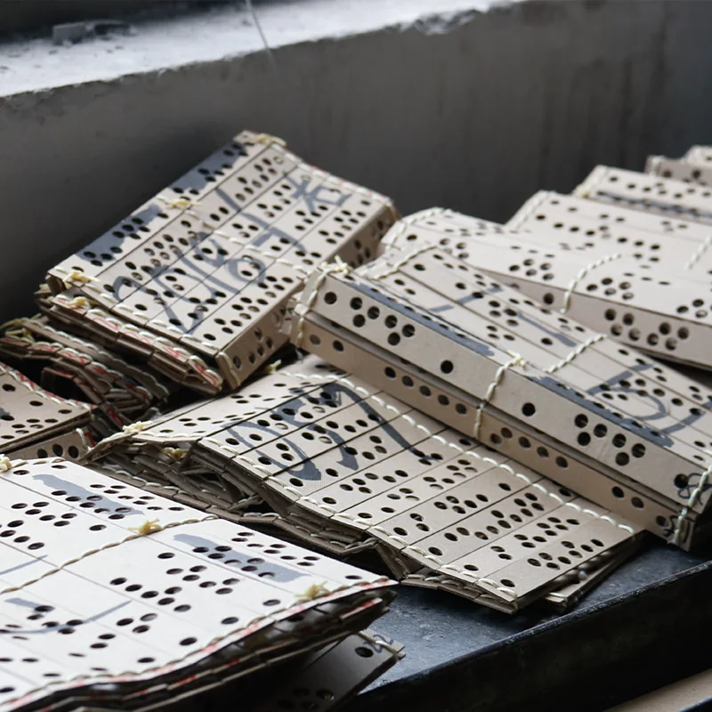 Punched pattern cards stacked for preparation