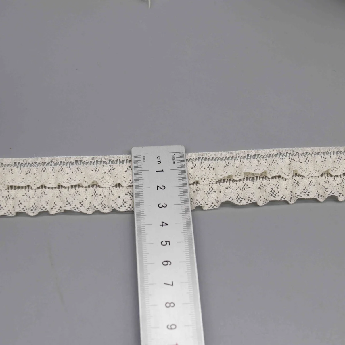 A Fine Mesh Or Pointelle Lace Gathered Stitched Ruffled Lace Trim for Garment Trim