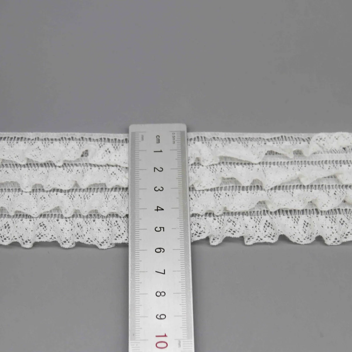 A Fine Mesh Or Pointelle Lace Gathered Stitched Ruffled Lace Trim for Garment Trim