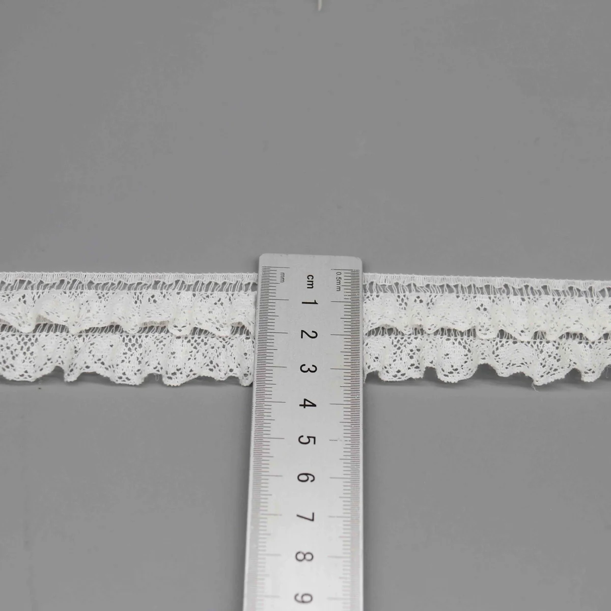 A Fine Mesh Or Pointelle Lace Gathered Stitched Ruffled Lace Trim for Garment Trim