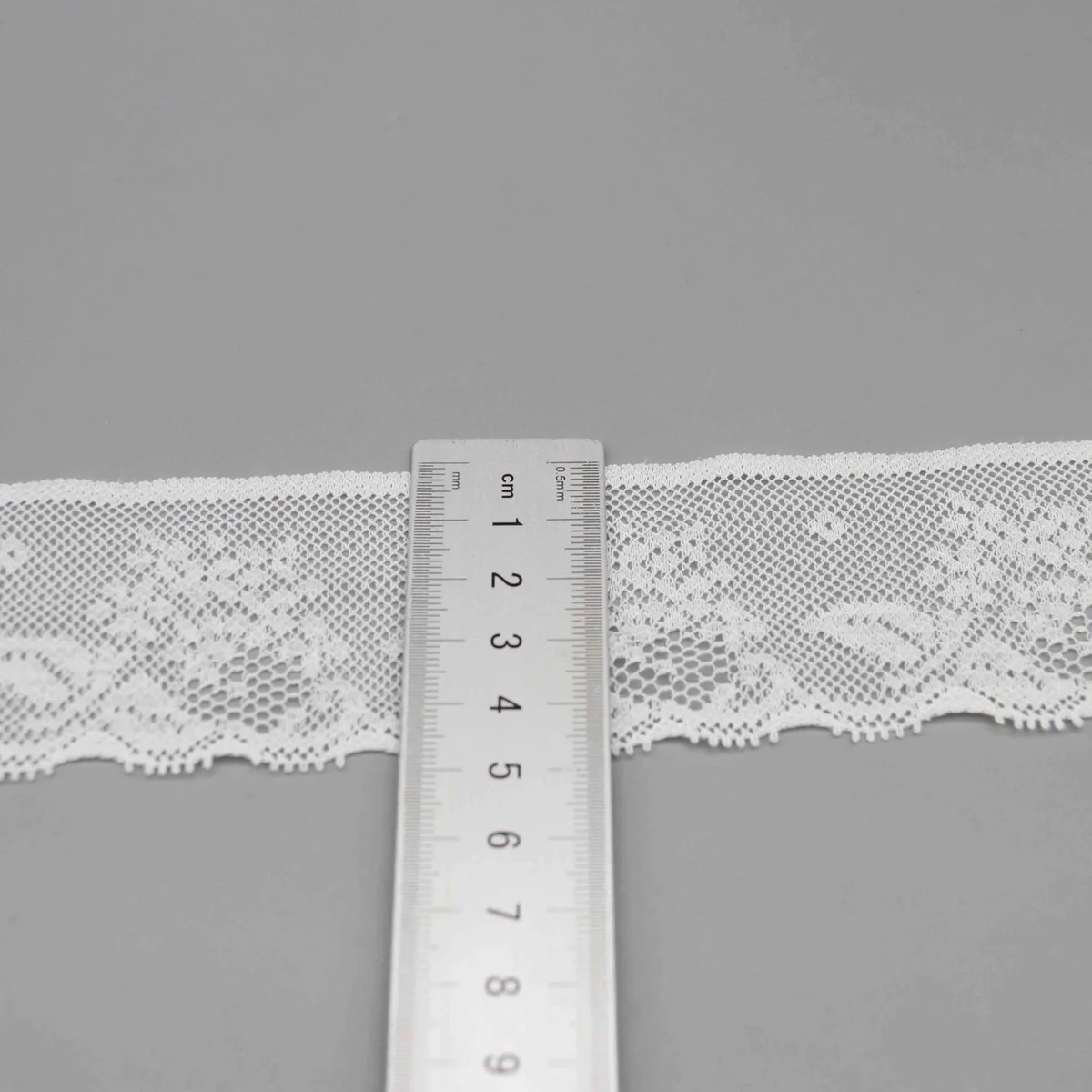 Floral Motifs On A Mesh Ground. One Design Lace Trim for Lingerie