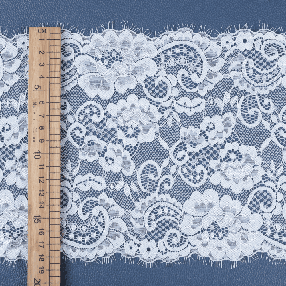 Crochet-effect vintage lace trim constructed from polyester and cotton, offering antique charm for couture and tailoring projects.