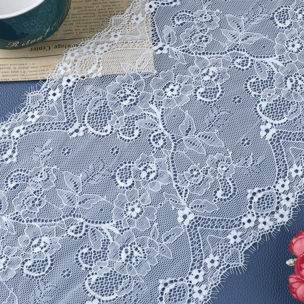 Delicate floral lace trim with intricate patterns, perfect for enhancing garments, dresses, and fashion accessories.