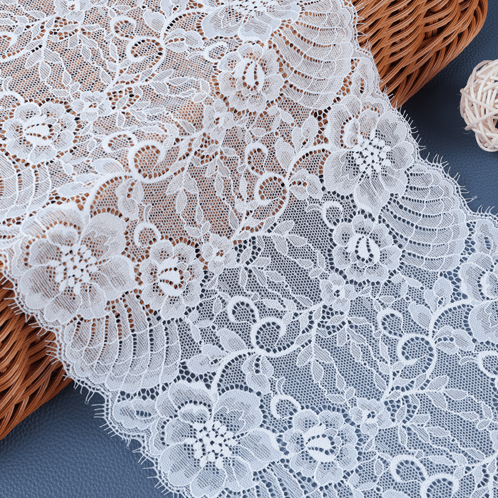 Ecru polyester–cotton vintage lace fabric with retro texture and delicate borders, perfect for DIY sewing and craft embellishments.
