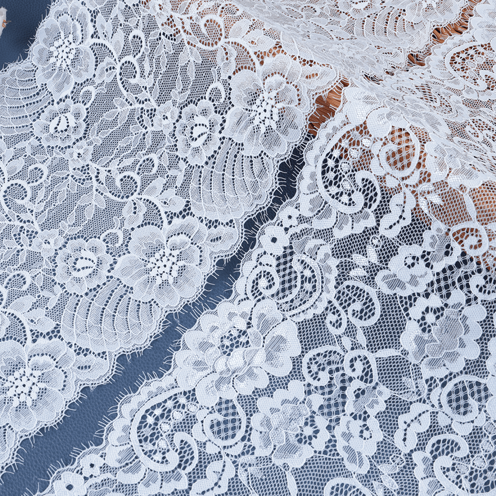 Wide polyester–cotton vintage lace with ornate patterning, suitable for curtains, table runners, and fashion garments.