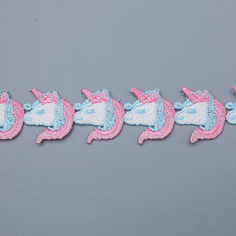 Selection of water soluble lace featuring ombre gradients, bold solid tones, and undyed white versions for unique garment accents.