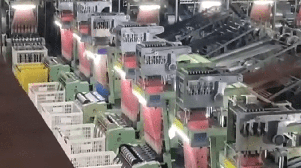 Large-scale production factory equipped for bulk orders of black and red cotton thread lace, with integrated quality assurance and modern equipment.