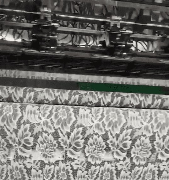 Spacious lace production plant featuring digital jacquard systems and strict quality control stations, supporting custom designs and fast turnaround.