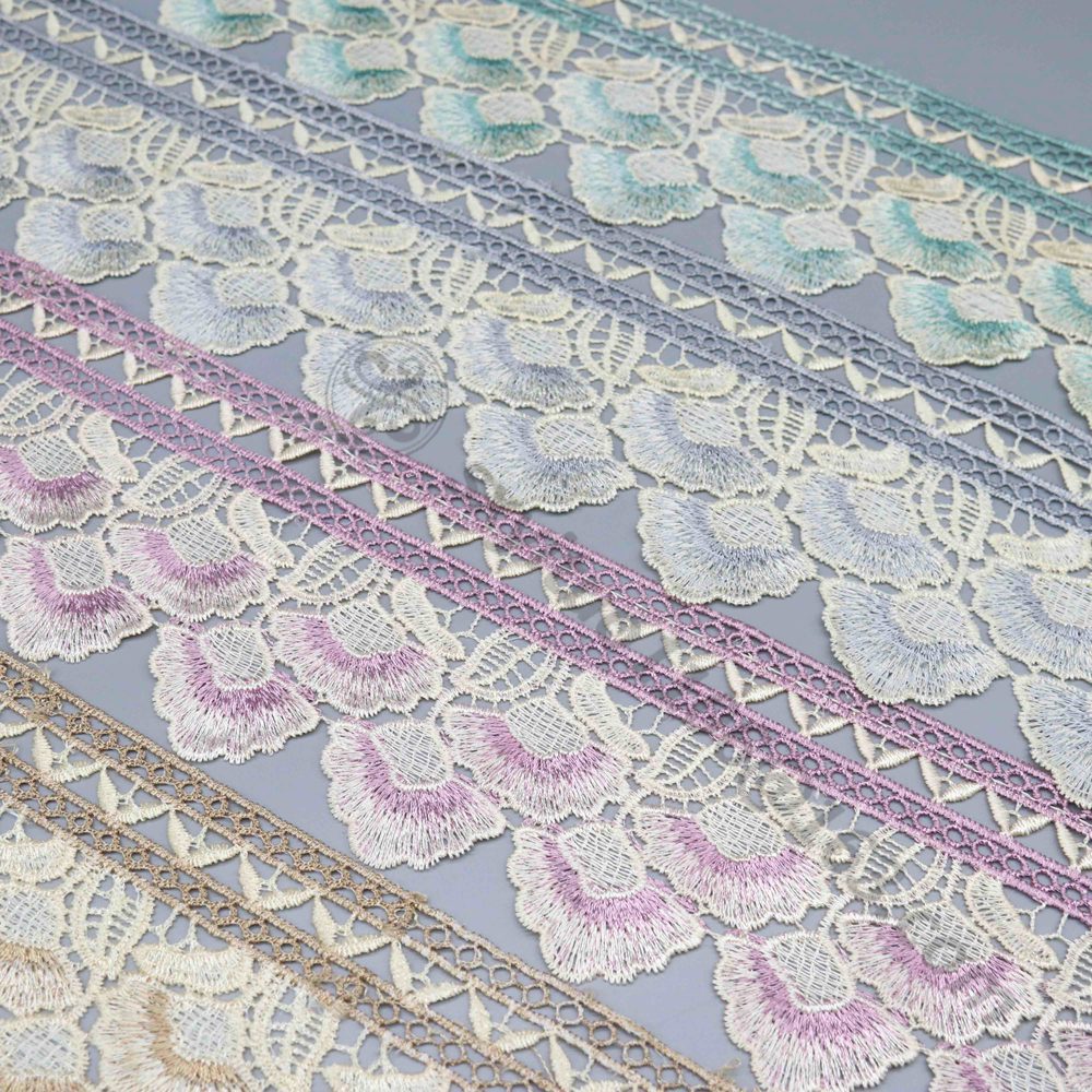 Side-by-side display of intricate embroidery water soluble lace and classic eyelet water soluble fabric, showcasing preferred choices for OEM designer collections.