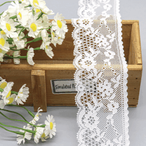 High-resolution image of bestselling white lace trim showcasing delicate floral and vine patterns in a sophisticated layered layout, with elegant scalloped edges and fine mesh embroidery for a lightweight, romantic effect on wedding dresses.