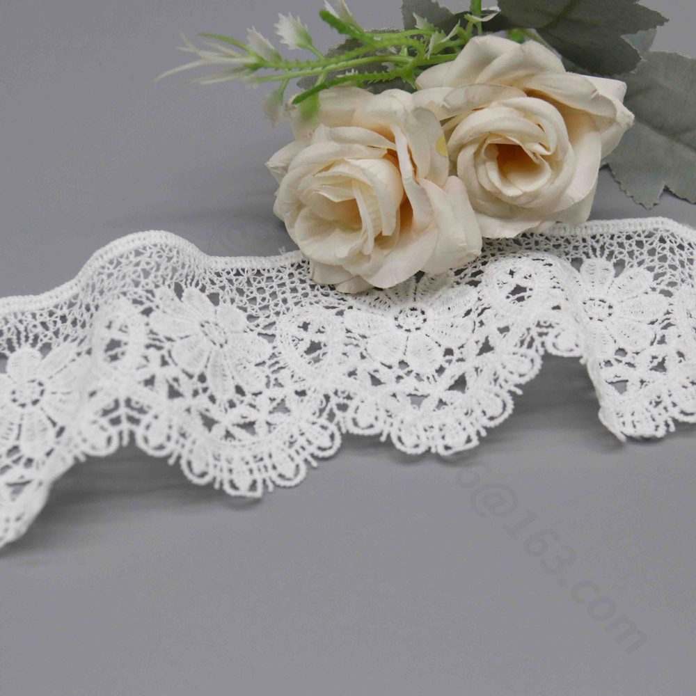 Vibrant image of new stock milk silk polyester lace trim in elegant snow white, featuring detailed hollow Guipure embroidery with floral and geometric patterns in 3D layered form and fluid wave edges; fine and adaptable for bag handles, dress skirts, collar accents, and creative fashion touches.