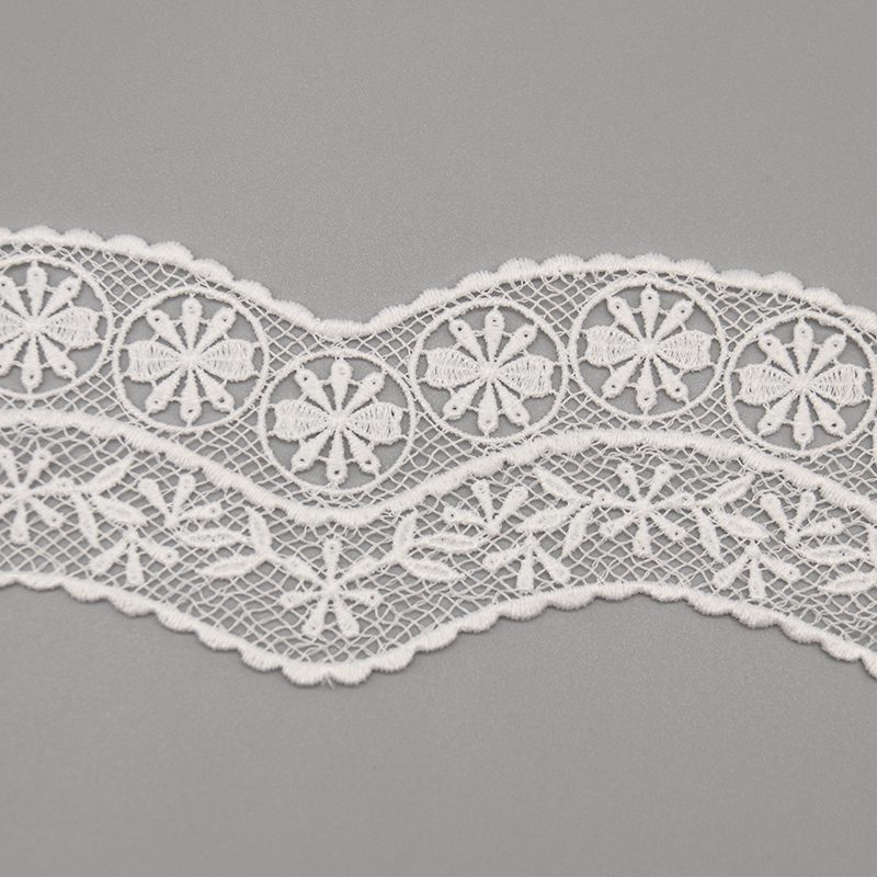 Sophisticated display of customizable French lace trim in pure white, with elaborate embroidery on mesh featuring geometric circular designs radiating petal elements in rich, layered depth; elegant micro-wave edges and smooth lines perfect for enhancing garment details and fashion personalization.