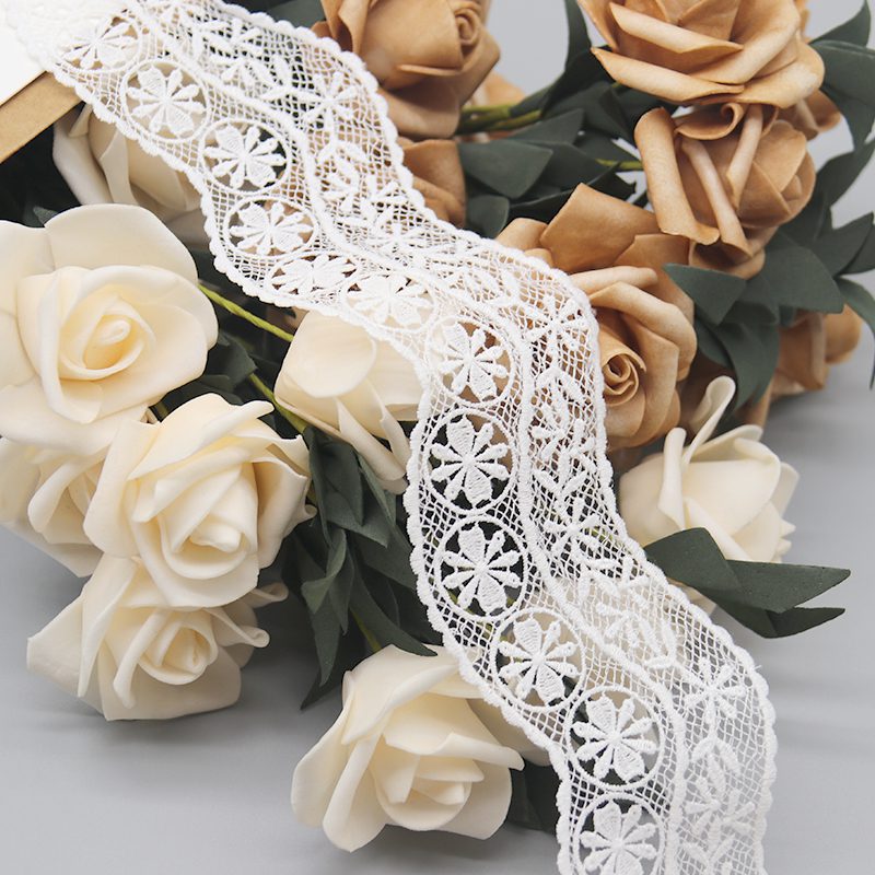 Close-up of sophisticated French-style customizable lace trim in pure white, featuring intricate embroidery on a mesh base with 3D geometric circular florals and radiating petal details in layered finesse; micro-wave edges with smooth contours for a high-end fashion touch, ideal for personalized garment accents.