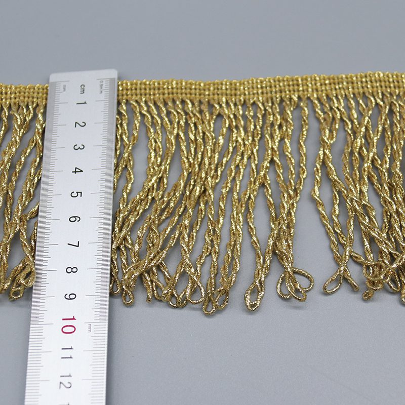 Macro shot of golden spiral twisted metallic thread details