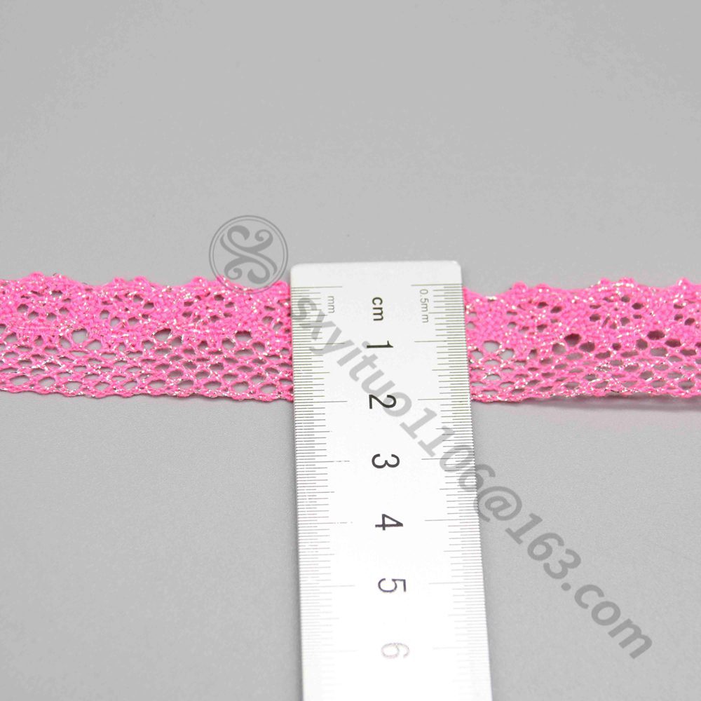 Ruler laid vertically across the lace trim showing the exact 2cm width measurement