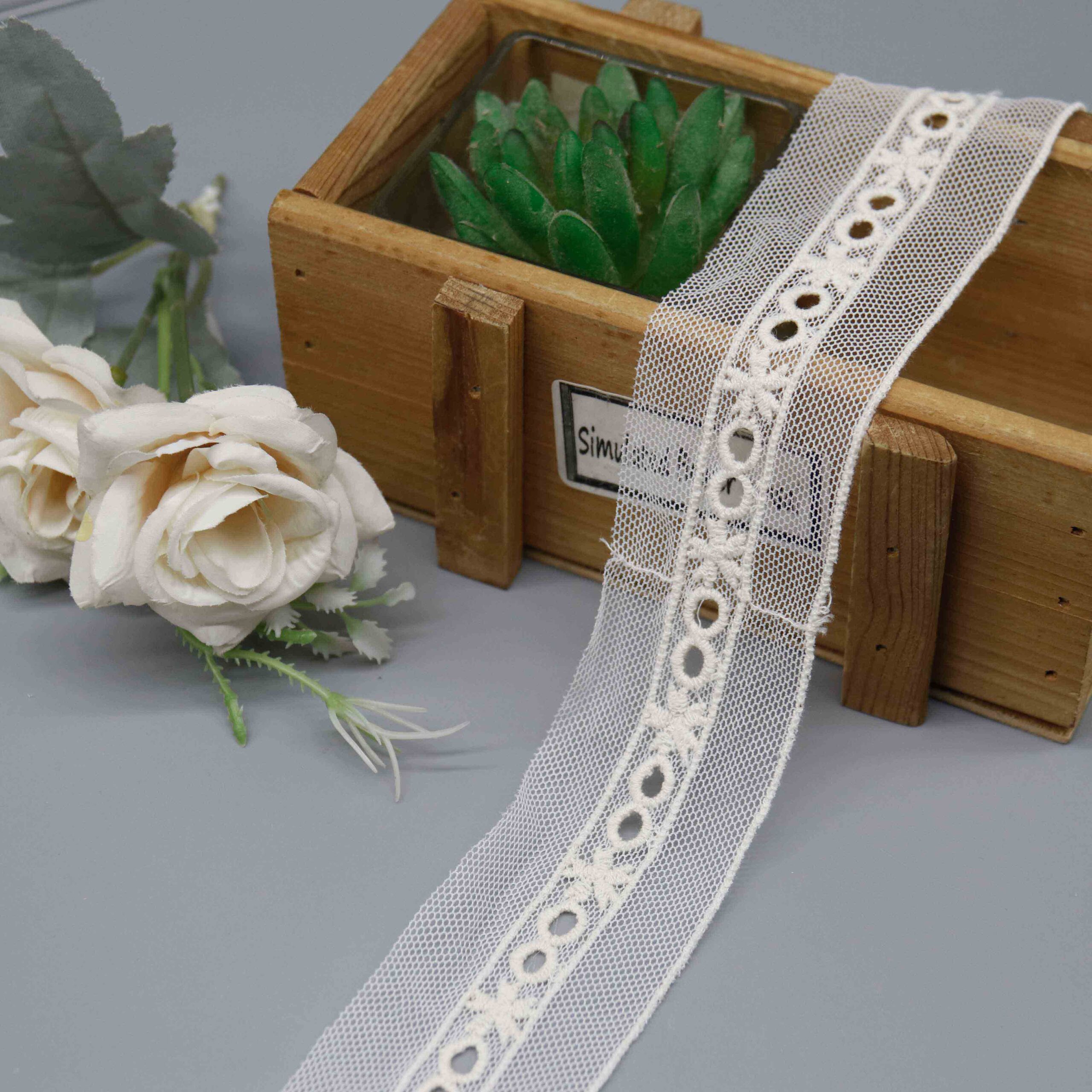 Front-facing shot of Butterfly Eyelet Polyester Mesh Embroidery Lace Trim, showing the circular openwork pattern and sheer tulle ground clearly.