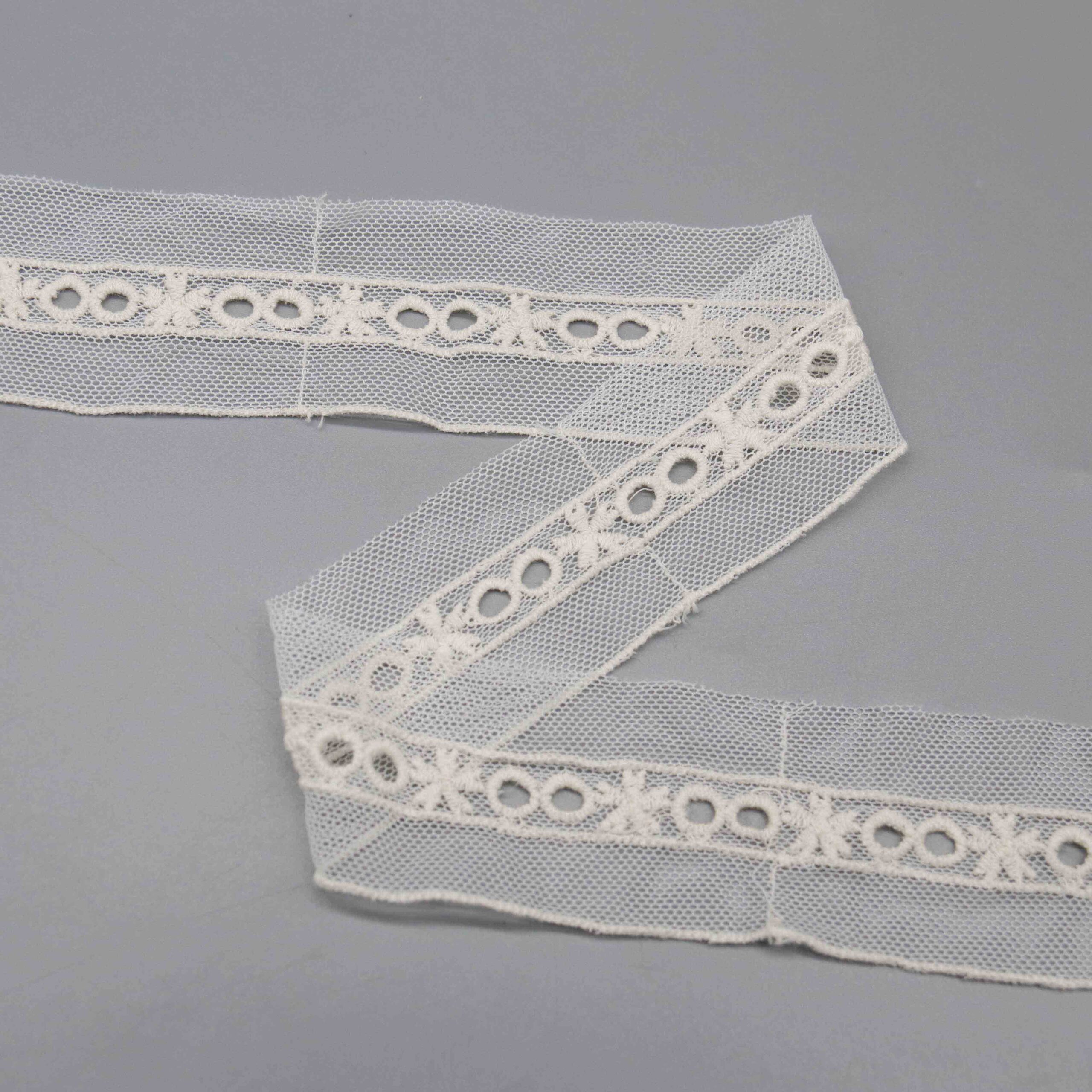 High-resolution detail showing the straight raw edge finish suitable for insertion applications.