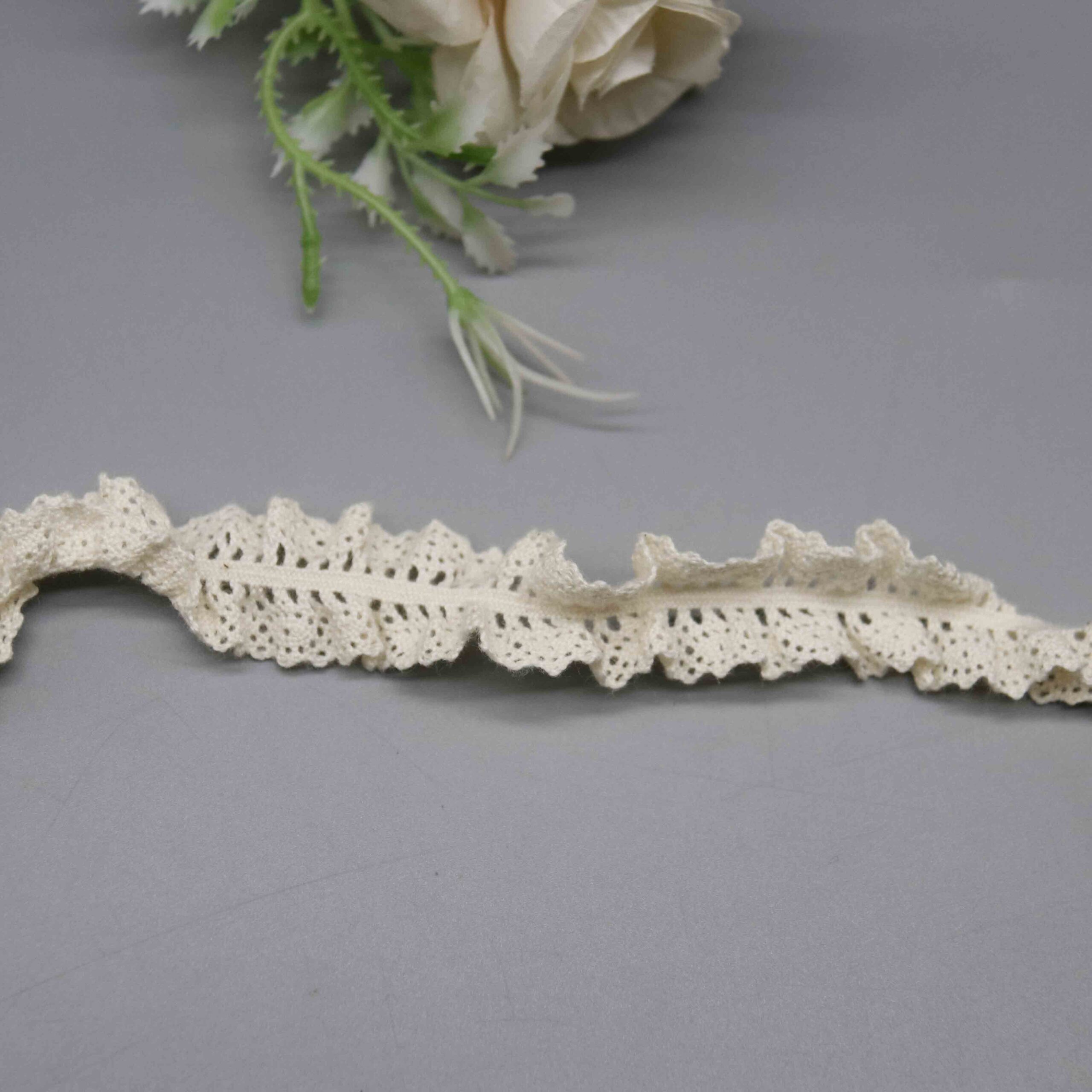 High-resolution focus on the pointed peak border and decorative frill hemline quality.