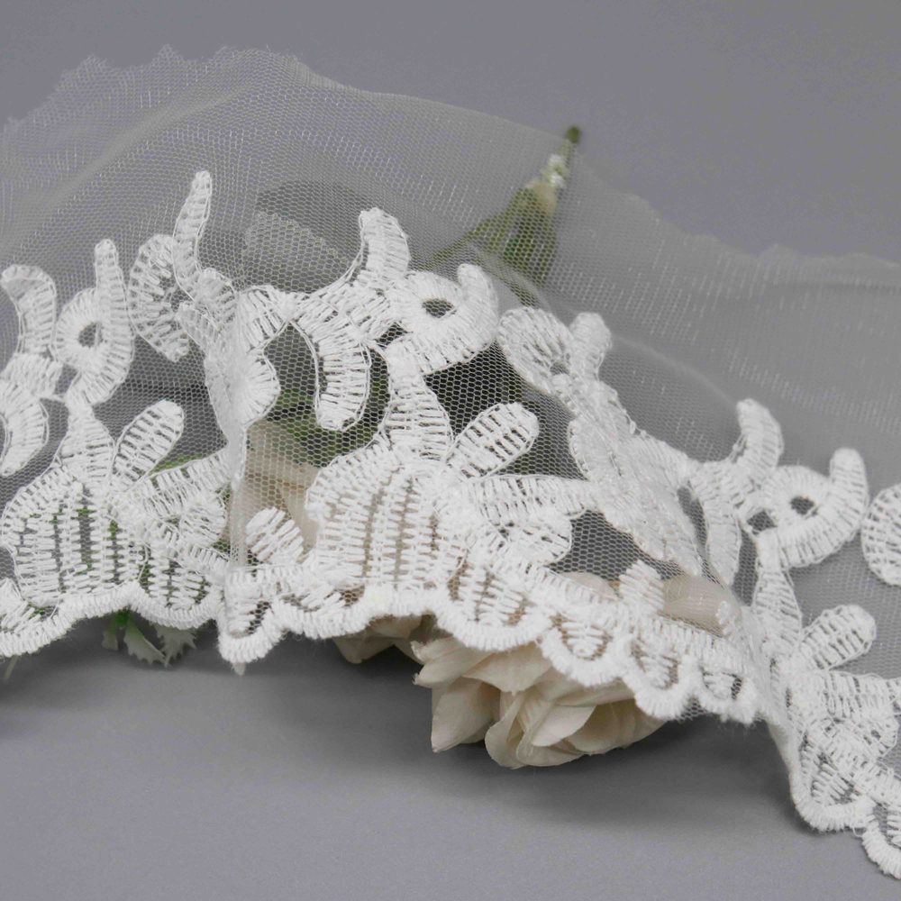 High-resolution focus on delicate border construction and organic floral edge quality.