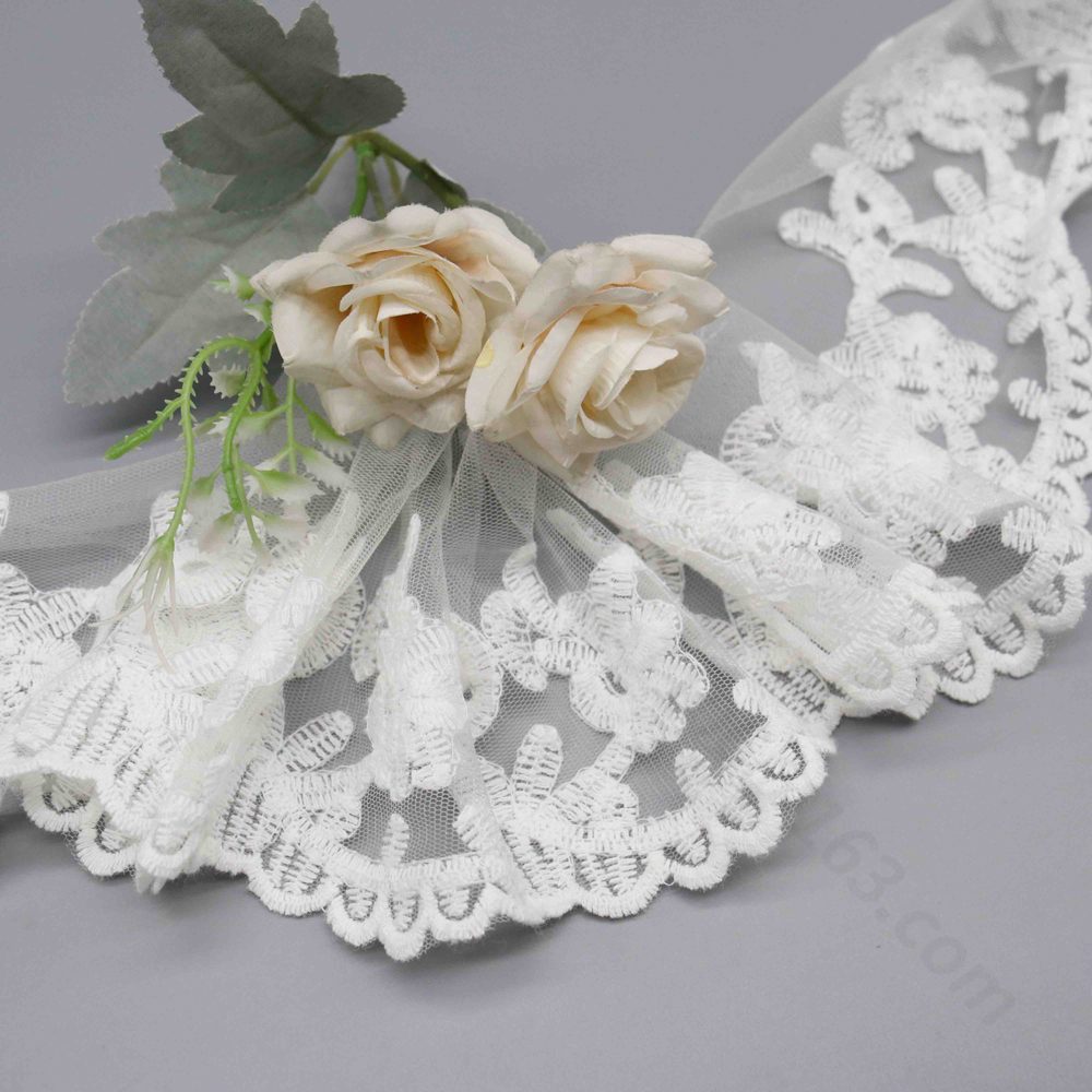 Angled view highlighting ethereal sheer finish and lightweight tactile sensation of fine net textile.