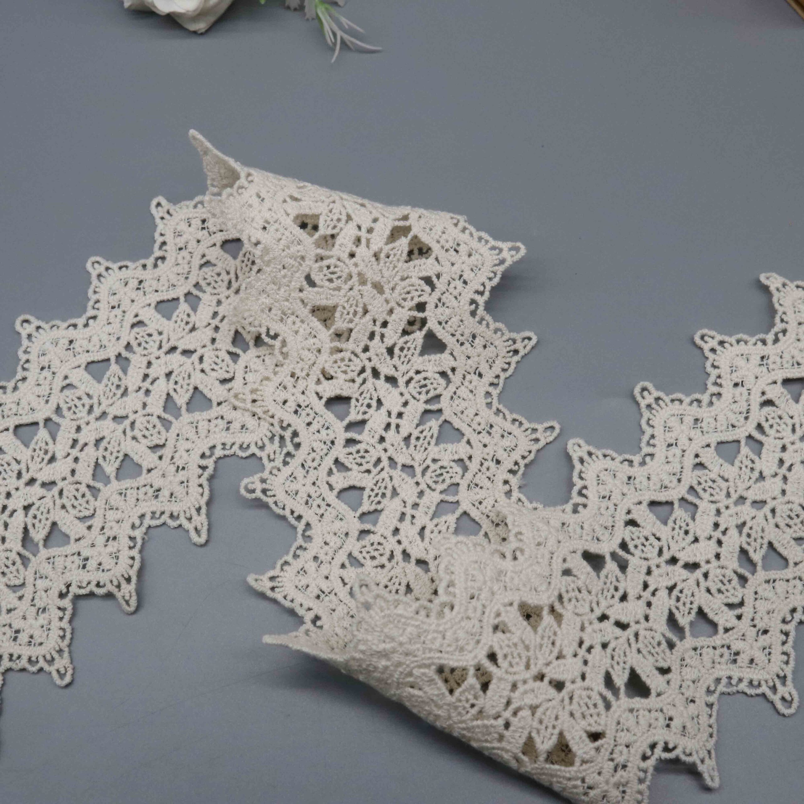 High-resolution focus on pointed peak border construction and decorative loop edging quality.