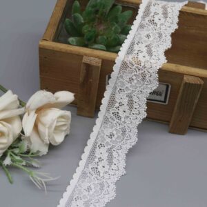 studio photo of a 3.6cm white stretch lace for lingerie, model HDL-1421, showing its fine floral pattern and single scalloped edge