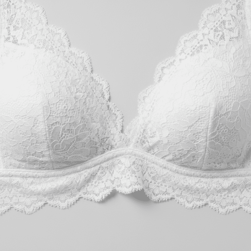 Close-up of a premium white elastic lace bralette showcasing the soft stretch texture and flat scalloped edges.