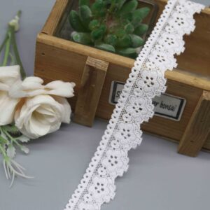 a 2.6cm white galloon stretch lace with a symmetrical floral pattern for lingerie bands.