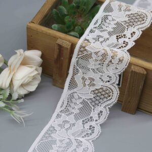 a 5.2cm wide white scalloped stretch lace with a classic floral design.
