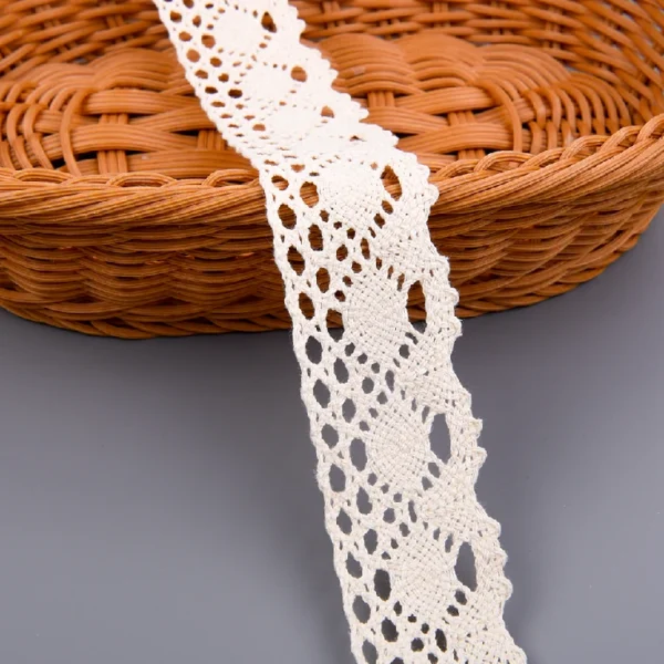 High-quality flower crochet lace trim in 100% cotton, available wholesale from factory with option to customize width for fashion garment use.
