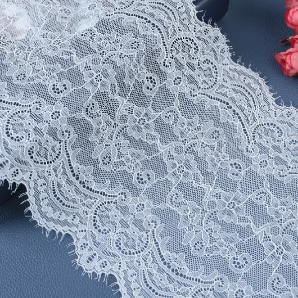 Delicate mesh lace trim with excellent stretch made of 90% nylon and 10% spandex, ideal for wedding dress designs.