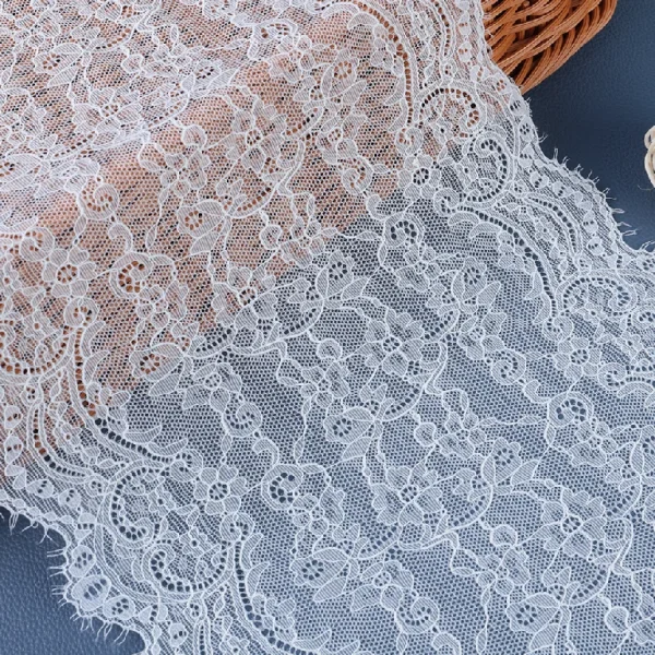 Bridal mesh lace trim made of elastic nylon and spandex blend, providing comfortable stretch for wedding dress accents.