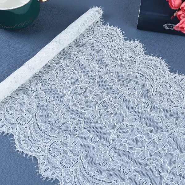 Fine mesh lace trim with stretch elasticity, crafted from 90% nylon and 10% spandex, designed for exquisite wedding dress details.