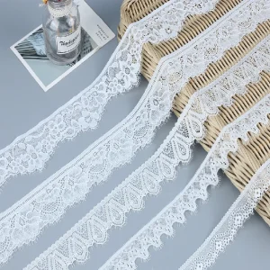 Elegant stretch Chantilly lace trim made from 90% nylon and 10% spandex, perfect elastic lace for fashion-forward dress designs.