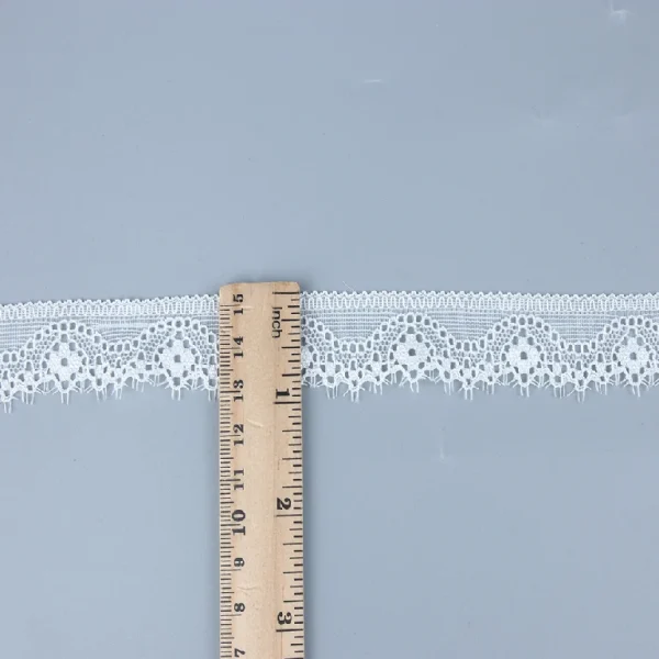 Beautiful elastic Chantilly lace trim crafted with 90% nylon and 10% spandex, designed to enhance fashion dresses with elegant details.