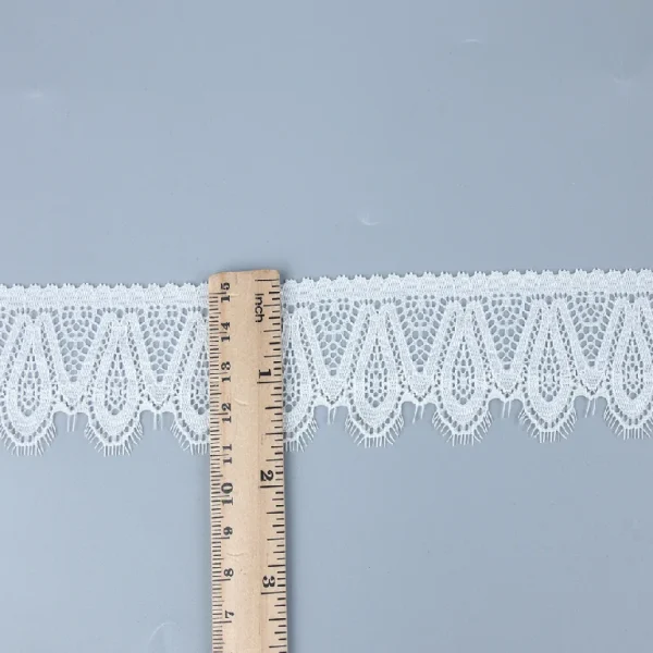 High-quality elastic Chantilly lace trim, made from nylon and spandex blend, perfect accent for creating fashionable dresses.