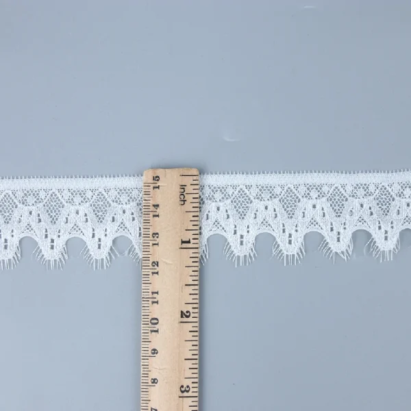 Fashionable Chantilly lace trim with 90% nylon and 10% spandex composition, stretchy elastic lace great for dress embellishment.