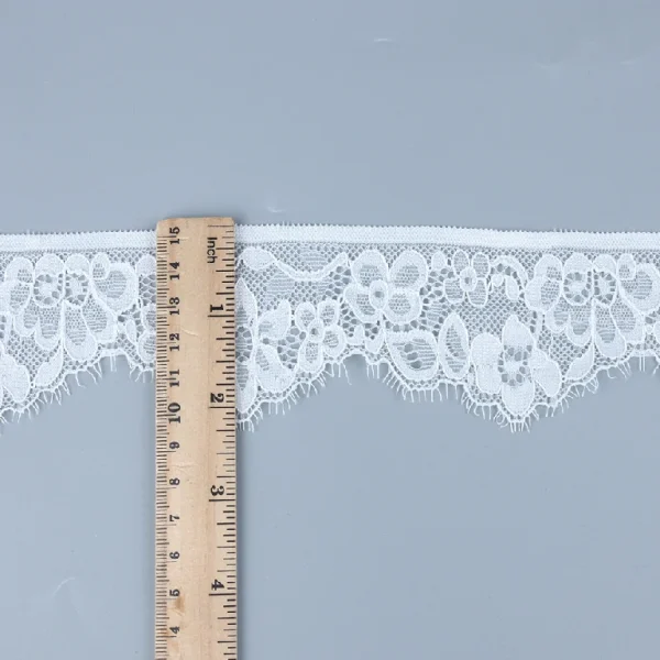 Elegant nylon and spandex blend Chantilly lace trim with excellent stretchability, designed for fashionable dress trims and accents.