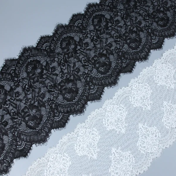 Elegant eyelash French lace trim made from 90% nylon and 10% spandex, perfect for adding delicate details to clothing designs.