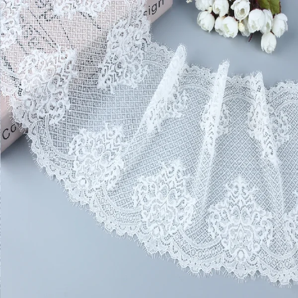 New release eyelash French lace trim made from a stretchy blend of 90% nylon and 10% spandex, ideal for modern clothing embellishments and design.