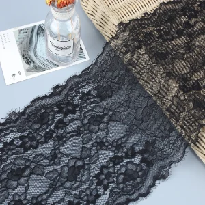 Black eyelash lace trim with detailed floral patterns and fine fringed eyelash edges, approximately 21 cm wide.