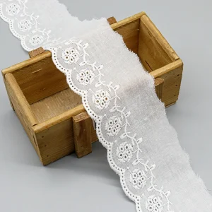 Elegant embroidered cotton lace trim made for bulk wholesale, featuring premium quality and custom factory designs for dresses and décor.