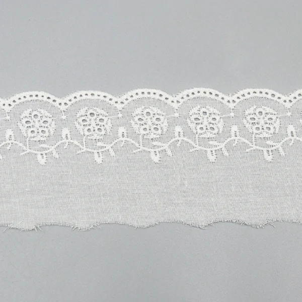 Premium cotton embroidered lace trim offered factory direct with custom design options, great for wholesale in fashion and bridal markets.