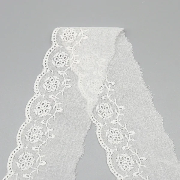 High-end embroidered cotton lace trim in premium quality, available for wholesale bulk orders with custom factory designs for multi-purpose use.
