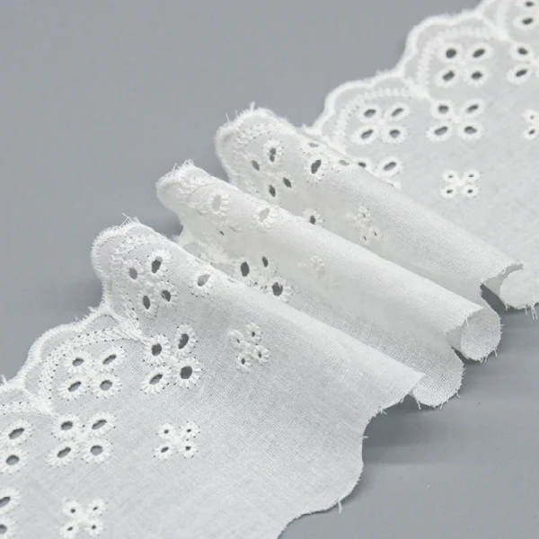 Top-selling flower eyelet lace trim made from pure cotton with detailed embroidery, ideal for garment embellishments.