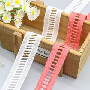 Colorful cotton embroidered lace trim featuring openwork design, perfect for adding decorative touches to clothing and DIY craft projects.