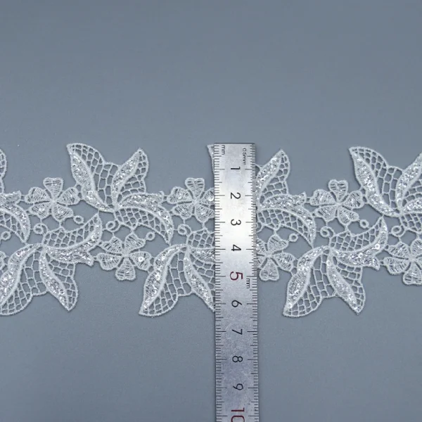 Elegant Flower Eyelet Water Soluble Lace Ribbon Made from 100% Polyester for Fashion Apparel.
