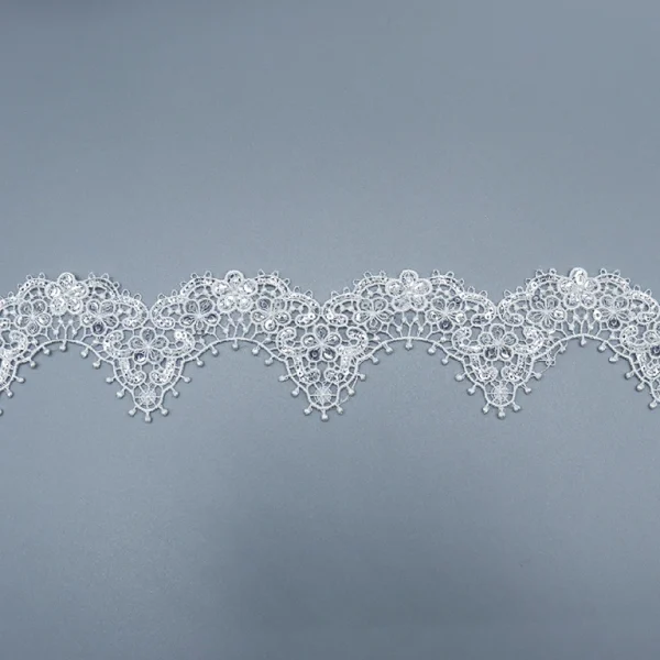 White Polyester Water Soluble Flower Lace Trim with Eyelet Pattern, Ideal for Dressmaking.